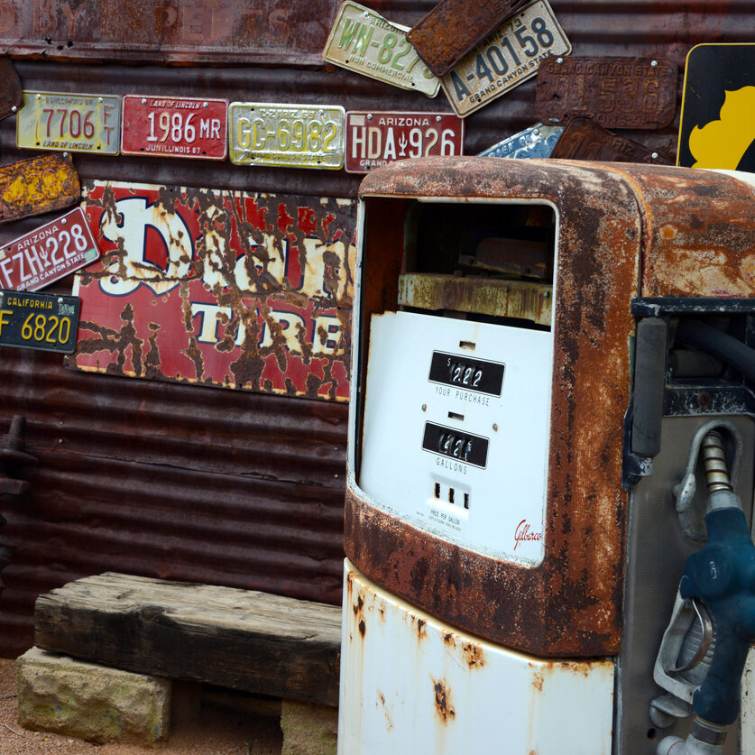 Hackberry, Arizona, 07/20/2013
old fuel pump in front of rusty corrugated iron wall with license plates